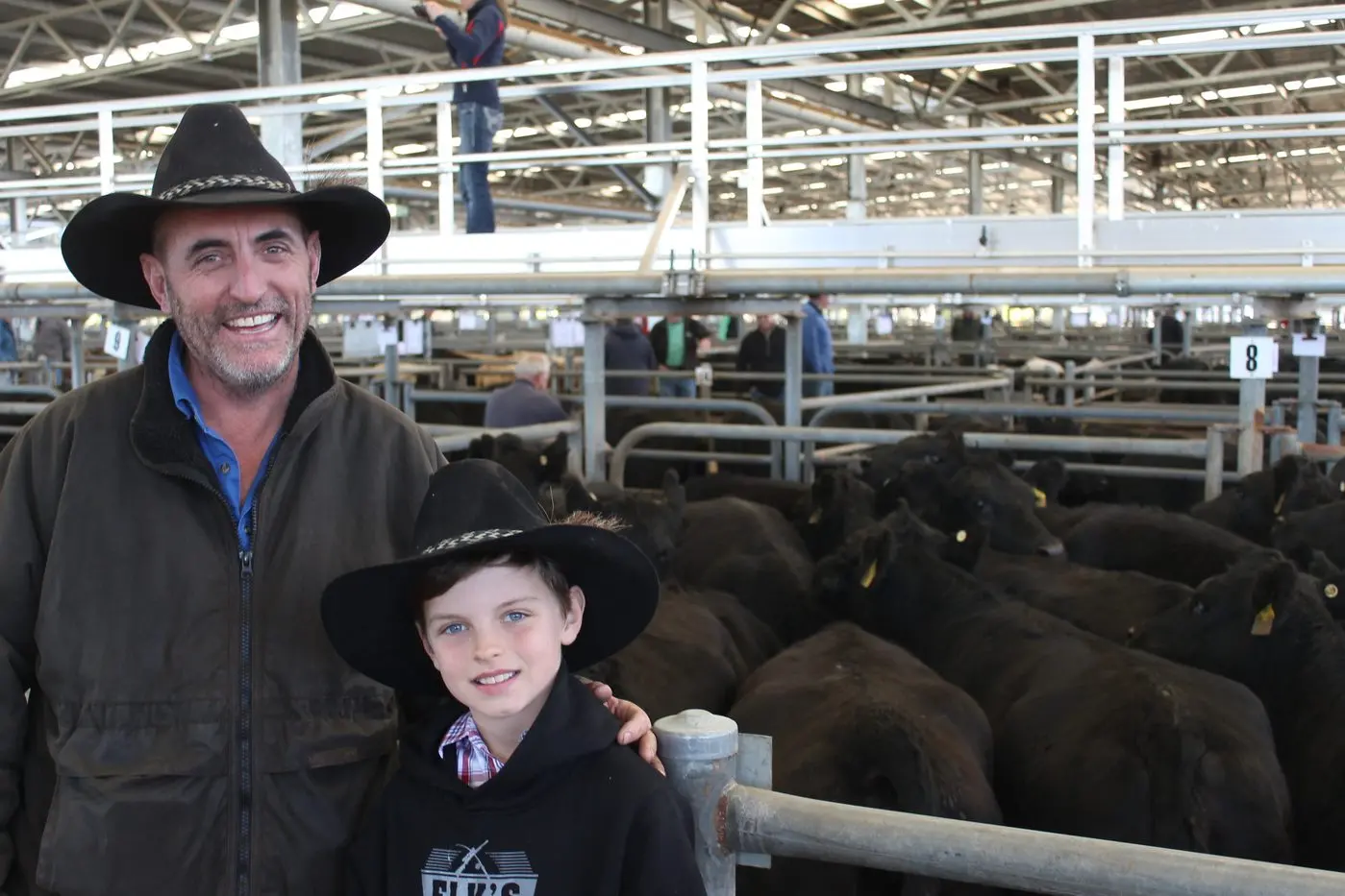 HAPPY DAYS: Cattle farmer Connor Barton and his son MacGyver sold 204 Angus cows from their 2000 acre South Tallangatta farm on Friday.  PHOTO: Bailey Zimmermann Id:27259