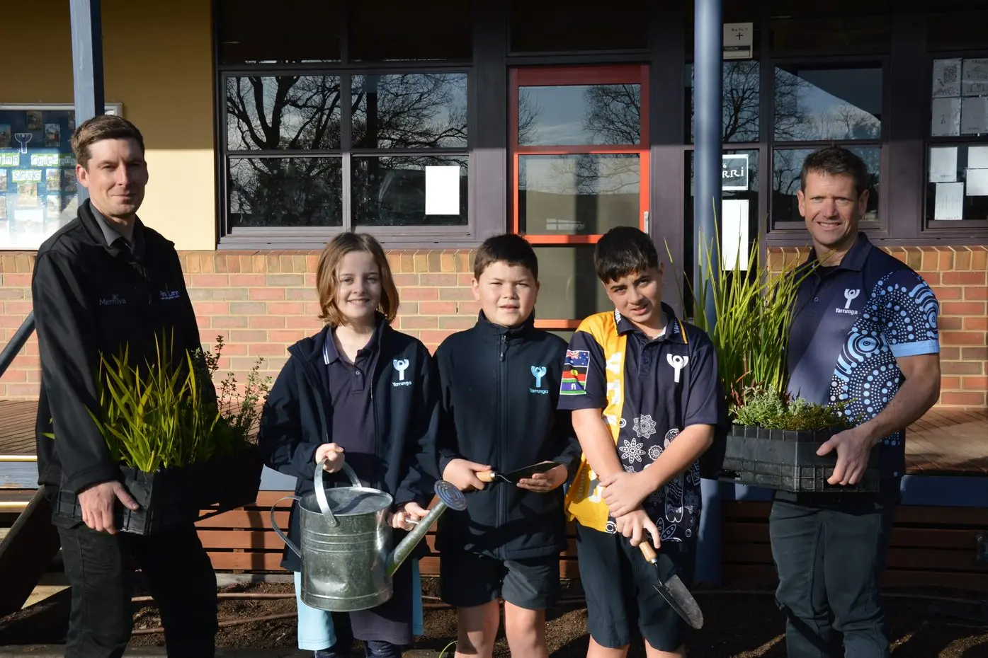 READY TO PLANT: Park Lane Nursery\\'s Lucas Brook, students Lily Britton, Zac Sayers and Jacob Jones, with Yarrunga Primary School teacher Matt Lorback, look forward to improving the landscape around the playground on Schools Tree Day. PHOTO: Anita McPherson