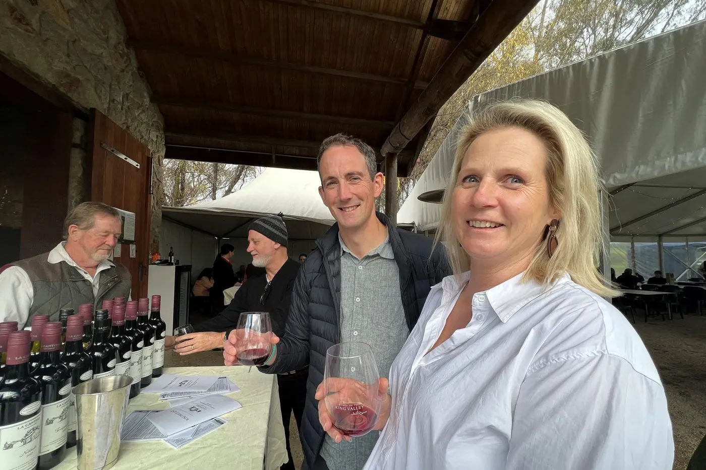 CHEERS: Kerryn Fletcher and Ben Roache sample wines at La Cantina King Valley, with the help of sommelier Lou Frost. PHOTOS: Jeff Zeuschner
