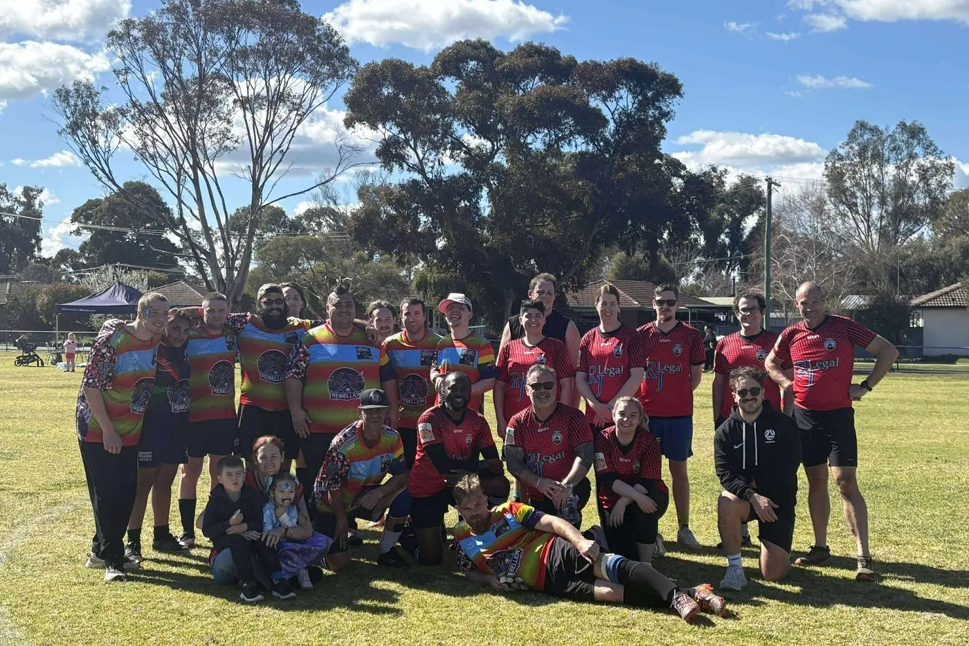 FRIENDS IN SOCCER: Council staff and Rebellion players celebrate after their clash against each other.