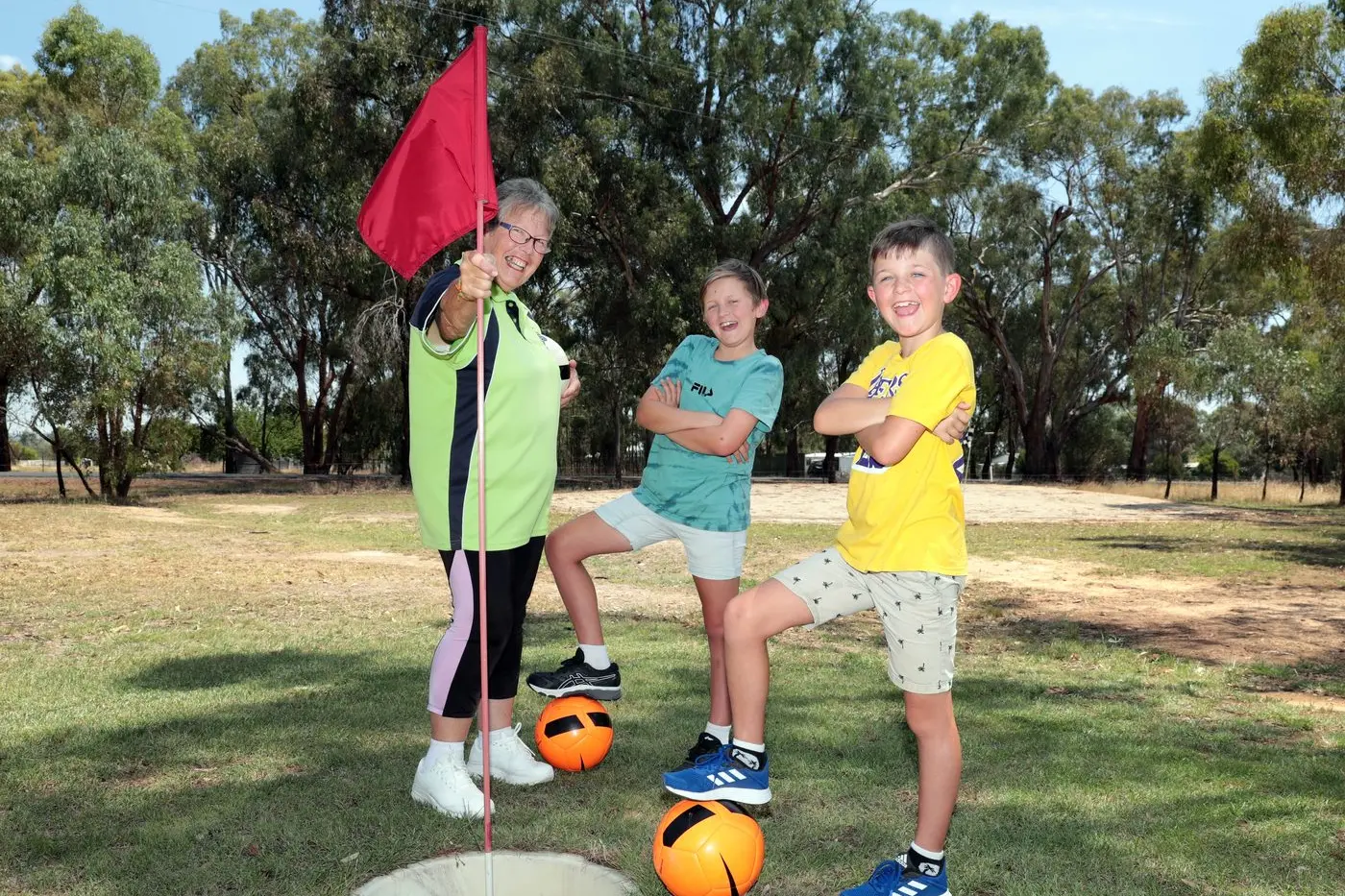 FUN FOR ALL AGES: (From left) Boorhaman Golf Club secretary Judy Byrne enjoying footgolf with grandchildren Kyle and Hayden Tyers. PHOTO: Kieren Tilly