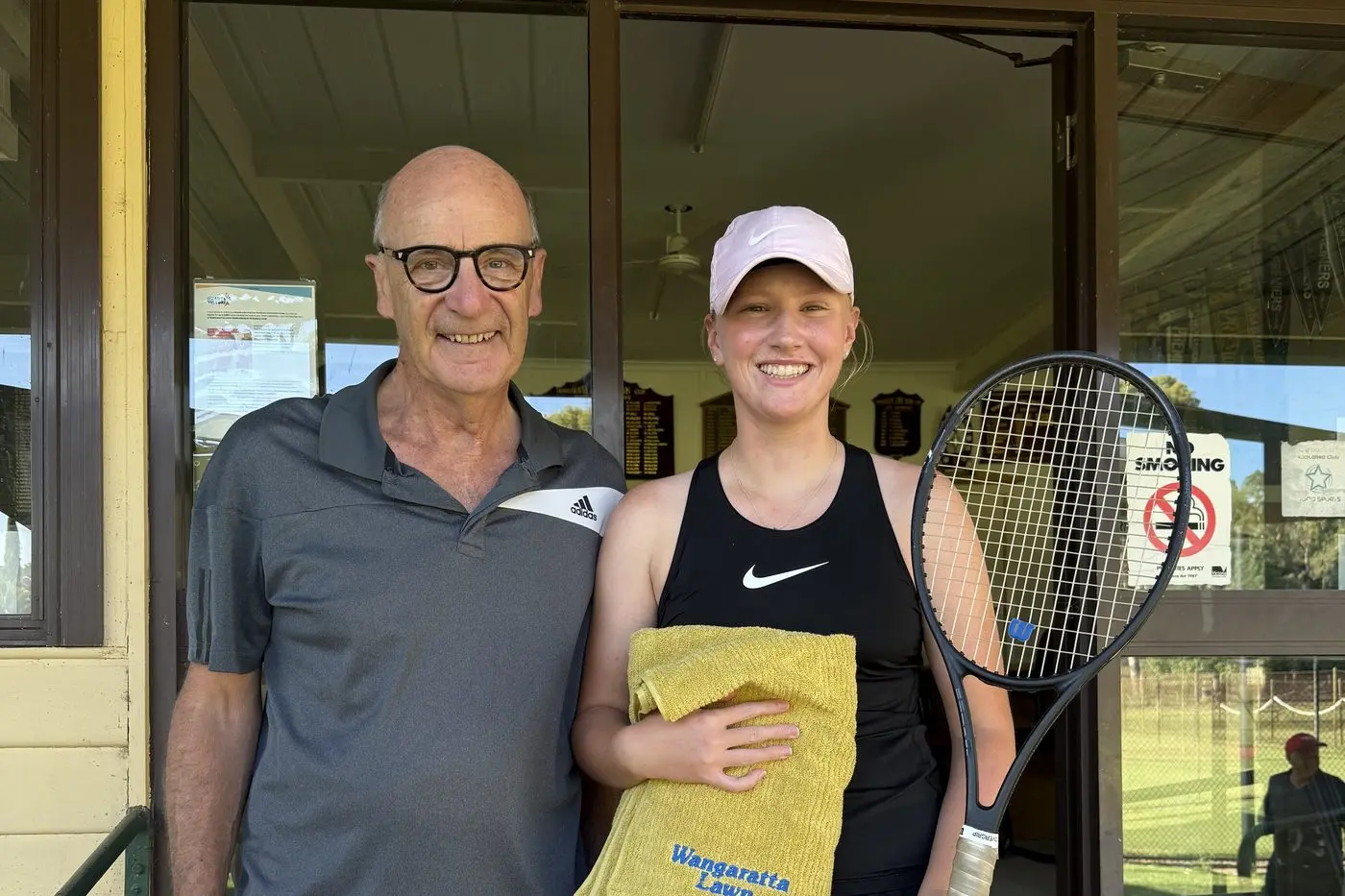 ON THE RISE: Matilda Dean after receiving her towel from club secretary Michael Falkenberg outside the WLCTP clubhouse.