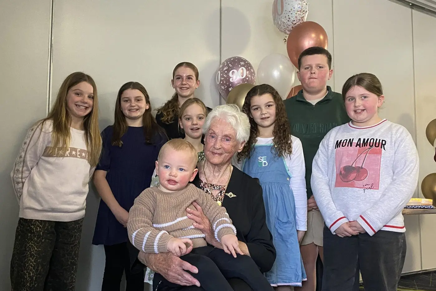 FOUR GENERATIONS STRONG: Nola Adamo (centre) with her great-grandchildren including Mason Donovan (on her lap) and (back, from left) Lylah Porter, Brock Chandler, Stella Chandler, Edwina Porter, Lucy Porter, Penny Porter and Grace Porter. 