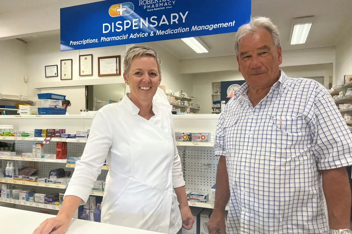 READY YOUR SLEEVES: Robertson Pharmacy pharmacist Megan Wadley and owner Bruce Robertson are starting to receive stock for flu vaccinations with flu season just a month away. PHOTO: Jeff Zeuschner
