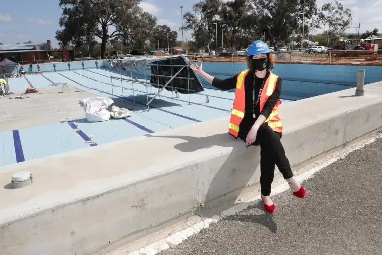 EXCITING TIMES: Sports, aquatic and events precinct manager Chloe Davies by the new 50-metre pool that will be the envy of many regional cities once complete in December. PHOTO: Kieren Tilly