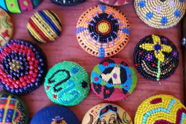 COLOURFUL DESIGNS: Thread and Line at the Benalla Art Gallery shop, includes a collection of intricately embroidered buttons created by Helen Pappas.