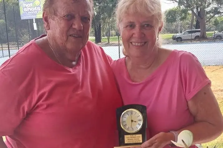 WELL DESERVED: Wangaratta Hardcourt Tennis Club president Dot Fox (left) presented Di Lucas with life membership to the club this month.