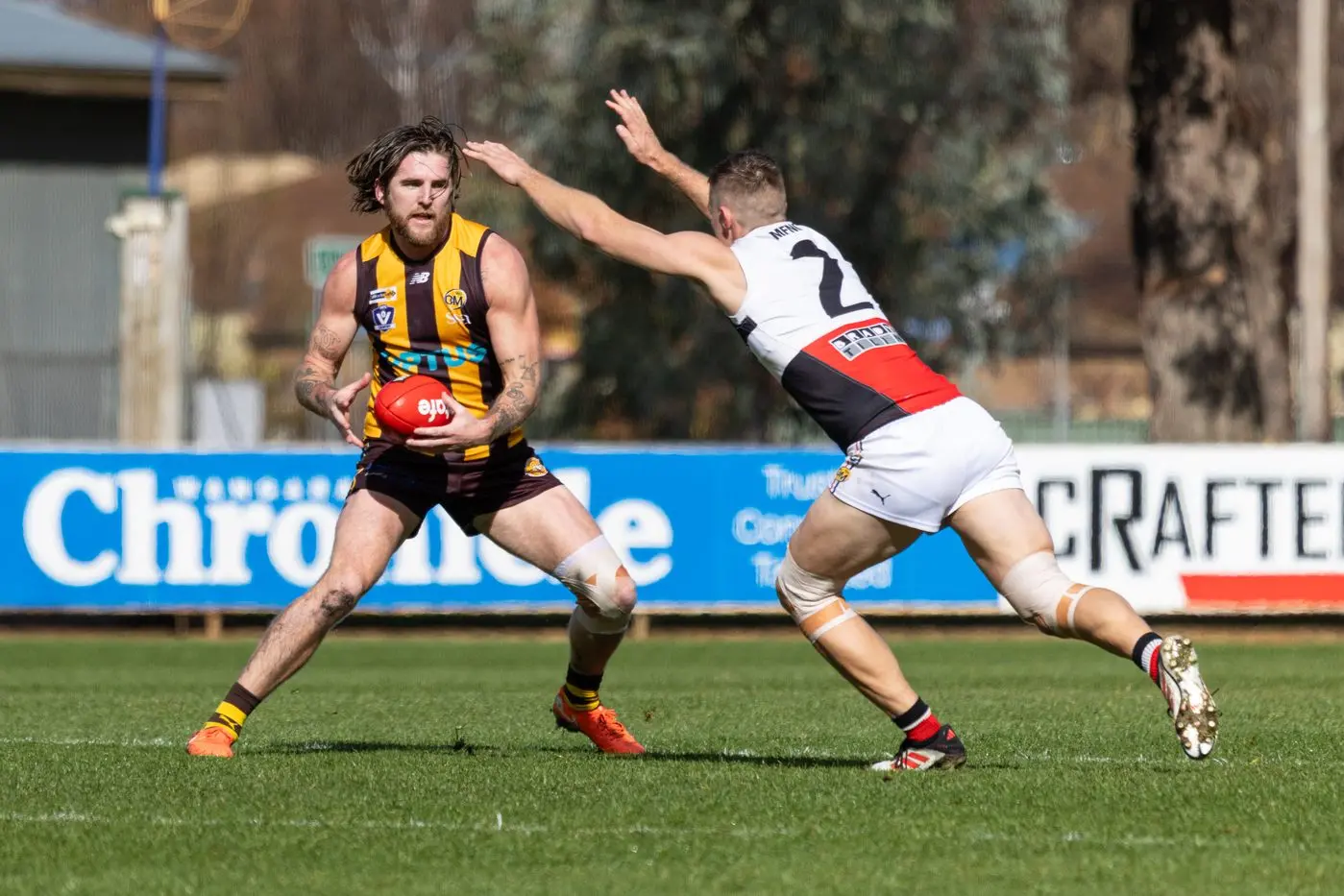QUICK STEP: Sam Murray sidesteps Jake Sharps dive. PHOTOS: Marc Bongers