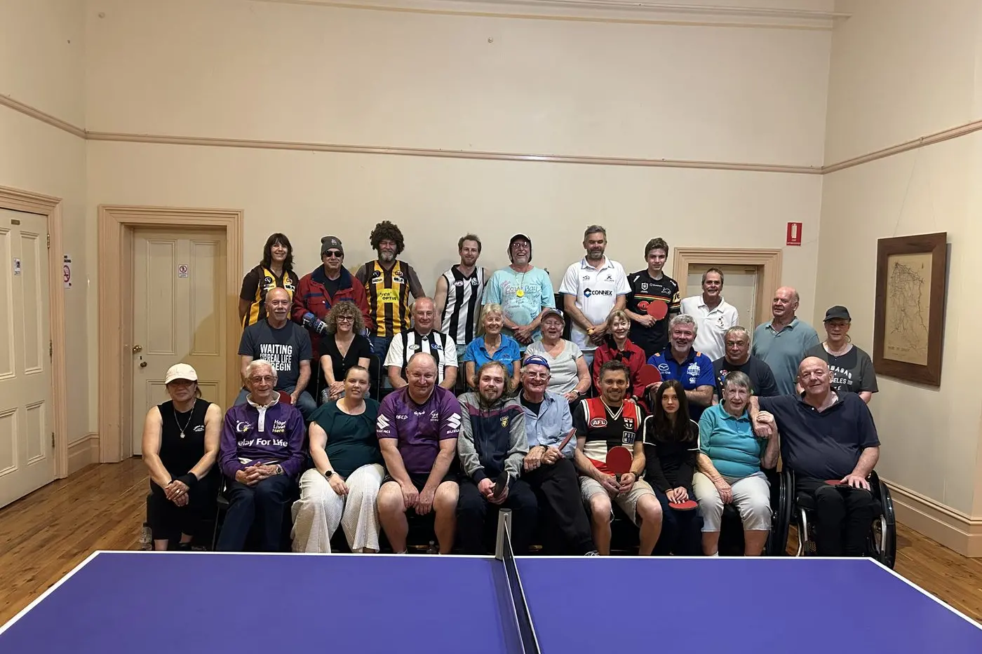 HAPPY GROUP: The Oxley social table tennis group. PHOTO: Kate Byvoet-Mullins