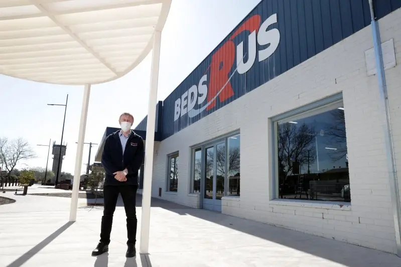 NOT TOO SOON: Gary Lidgerwood of Ligerwood\\u2019s Furniture on Norton Street is impressed with the attractiveness of the new street works and more than relieved they are finally nearing an end. PHOTO: Kieren Tilly\\n\\n