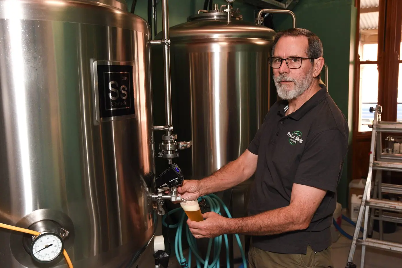 Straight from barrel to you: Enjoy unique and tasty craft beer from Wangaratta\\'s new boutique brewery, Pedal Slowly, served by the maker Terry Stubberfield. PHOTO: Kurt Hickling