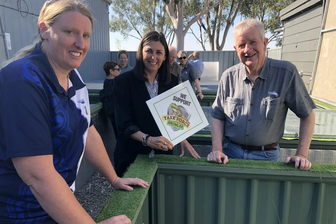 CHECKING GROWLING GRASS FROGS: Dr Lisa Farnsworth, Beth Mellick, executive director of Wettenhall Environment Trust, and Lance Lloyd, aquatic ecologist, inspect Growling Grass Frog breeding pods at Winton Wetlands.