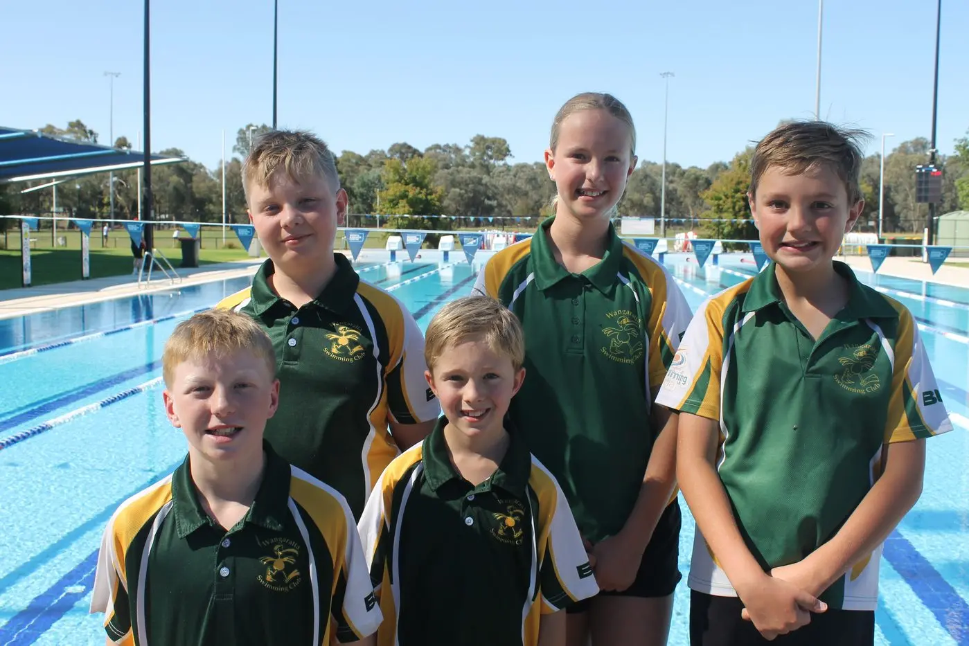 WELCOME TO THE POOL: Wangaratta Amatuer Swimming Club members (back, from left) Spencer Jackson, Zara Calish, Reg Colson, (front from left), Tom Benton and Ed Calish are looking forward to the swim meet this weekend. PHOTO: Nathan de Vries