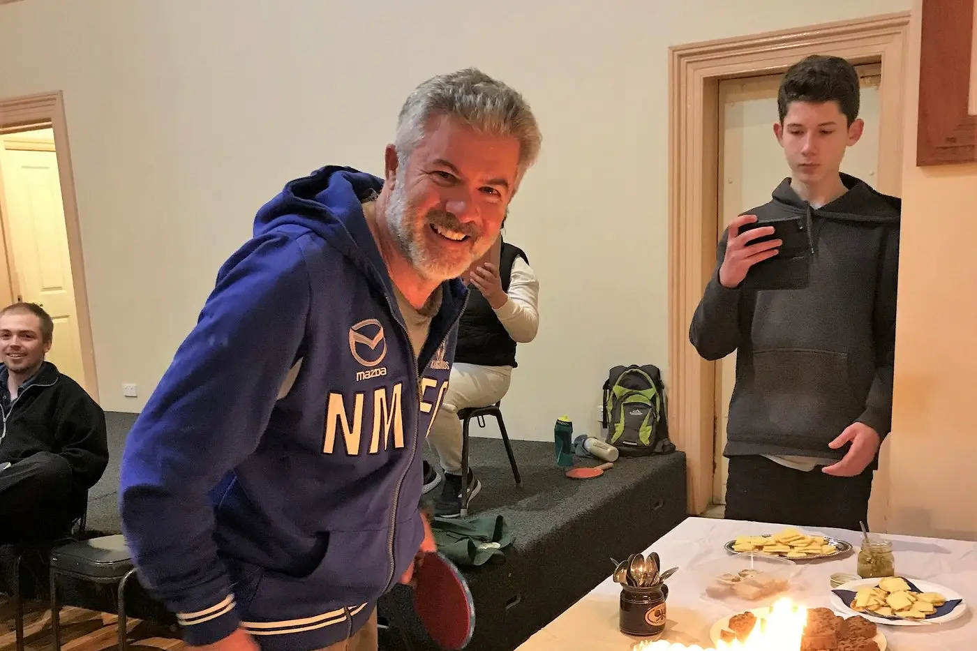 BIRTHDAY BOY: Jason Mullins was surprised when the Oxley table tennis group brought out a cake to celebrate his birthday.