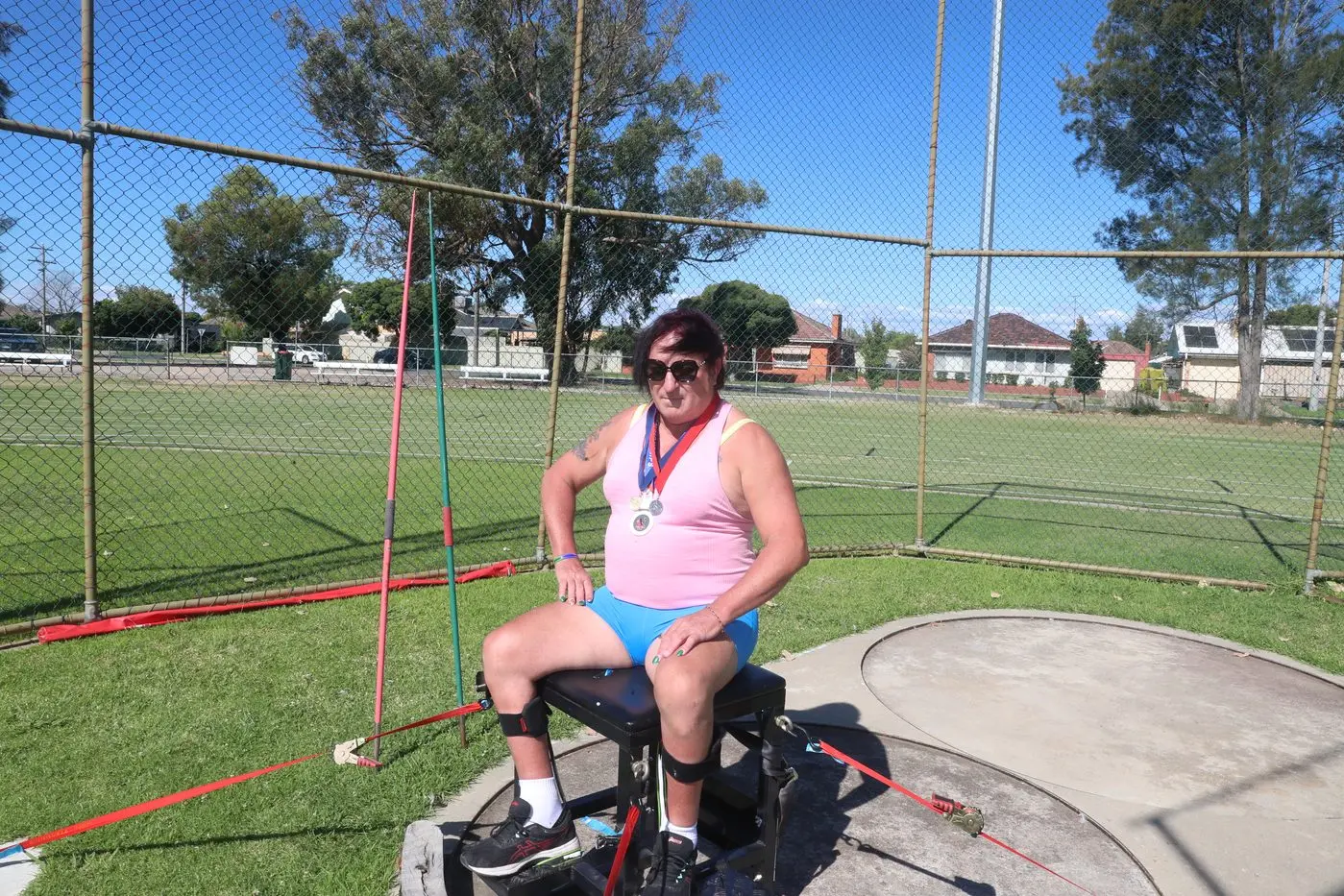 WINNER: Kate Fawkner with her three medals and trusty javelins. PHOTO: Nick Richards Id:19920