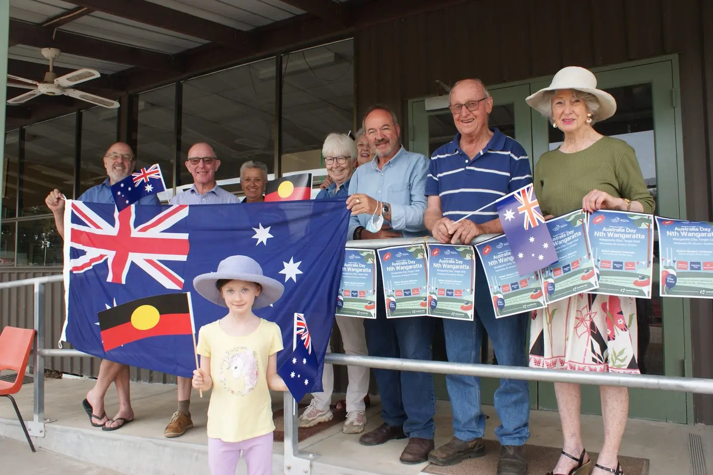 EXCITED FOR CELEBRATION: Tilly Pattison (seven, front) who is on holidays from Carlton with grandparents Marg and Clive Pullen was happy to be photographed with NWCG committee members Mike Glenister, Brian Reid, Mary Caruso, Rosemary Tennett, Dianne Glenister, Sandro Camillo and Clive and Marg Pullen as they prepared for Australia Day celebrations. PHOTO: Belinda Harrison Id:19255