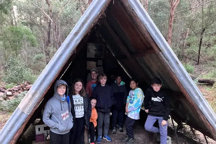 UNDERCOVER: Taking shelter in a hut at camp were students Mark Henschke, Maddie Newman, Marley Higham, Hayden Boyle, Ryan VanDerPoel, Dare Williams, Zara Cagas and Lewis Jones.