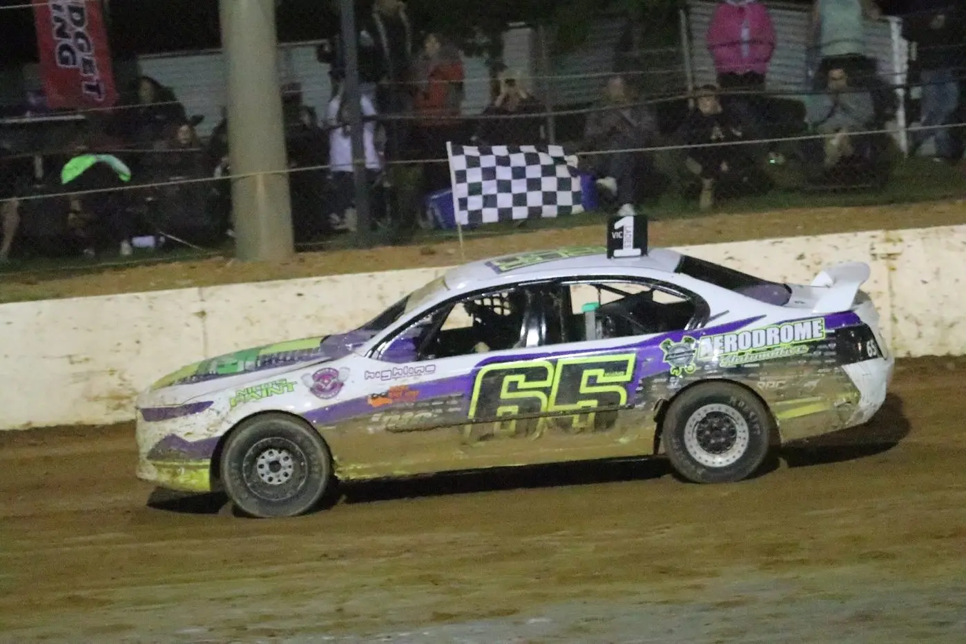 WINNER: Felicity Roycroft does a lap with the chequered flag. PHOTO: J&V Parker Photography