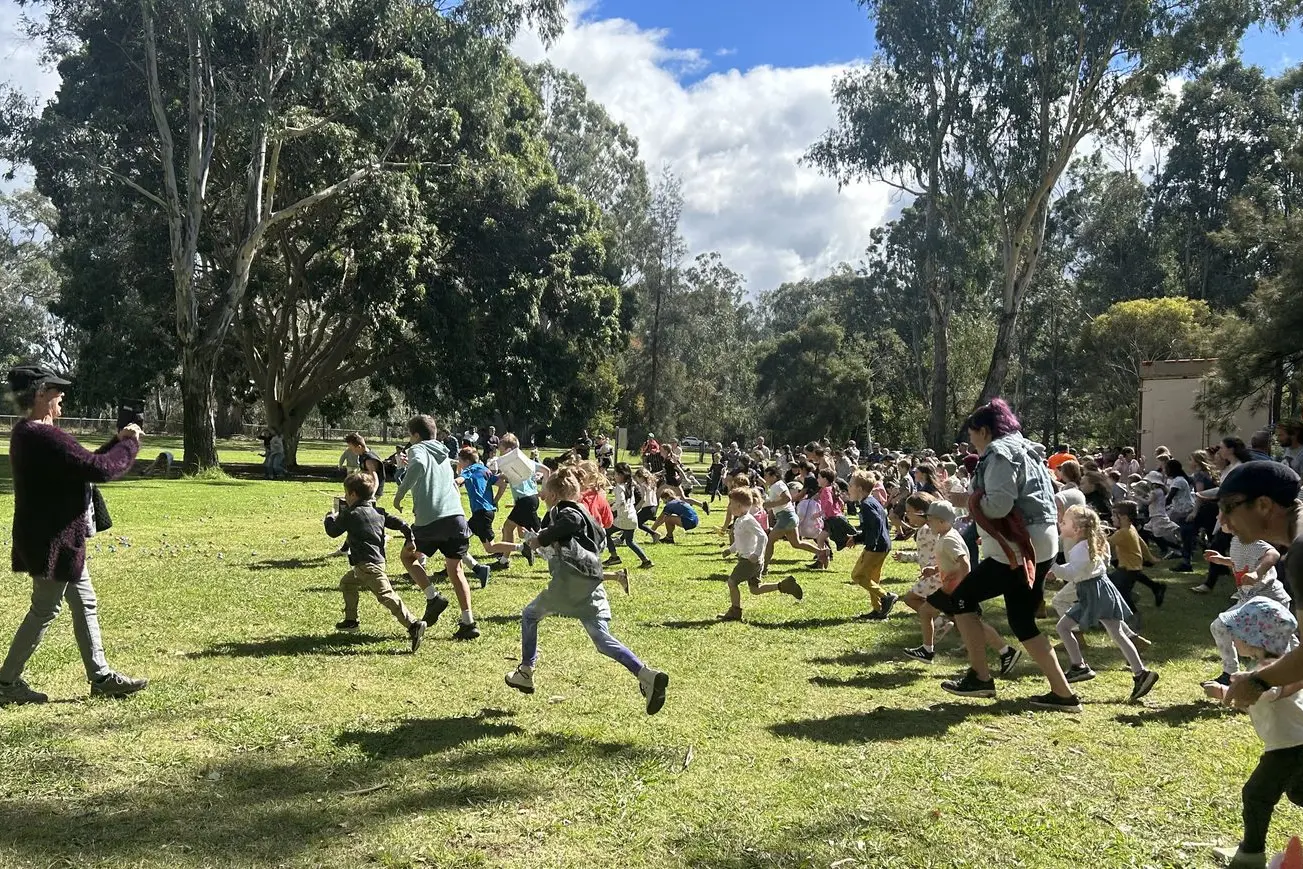 THE HUNT IS ON: Egg hunters set off in pursuit during last year\\'s Easter egg hunt at Apex Park.\\n