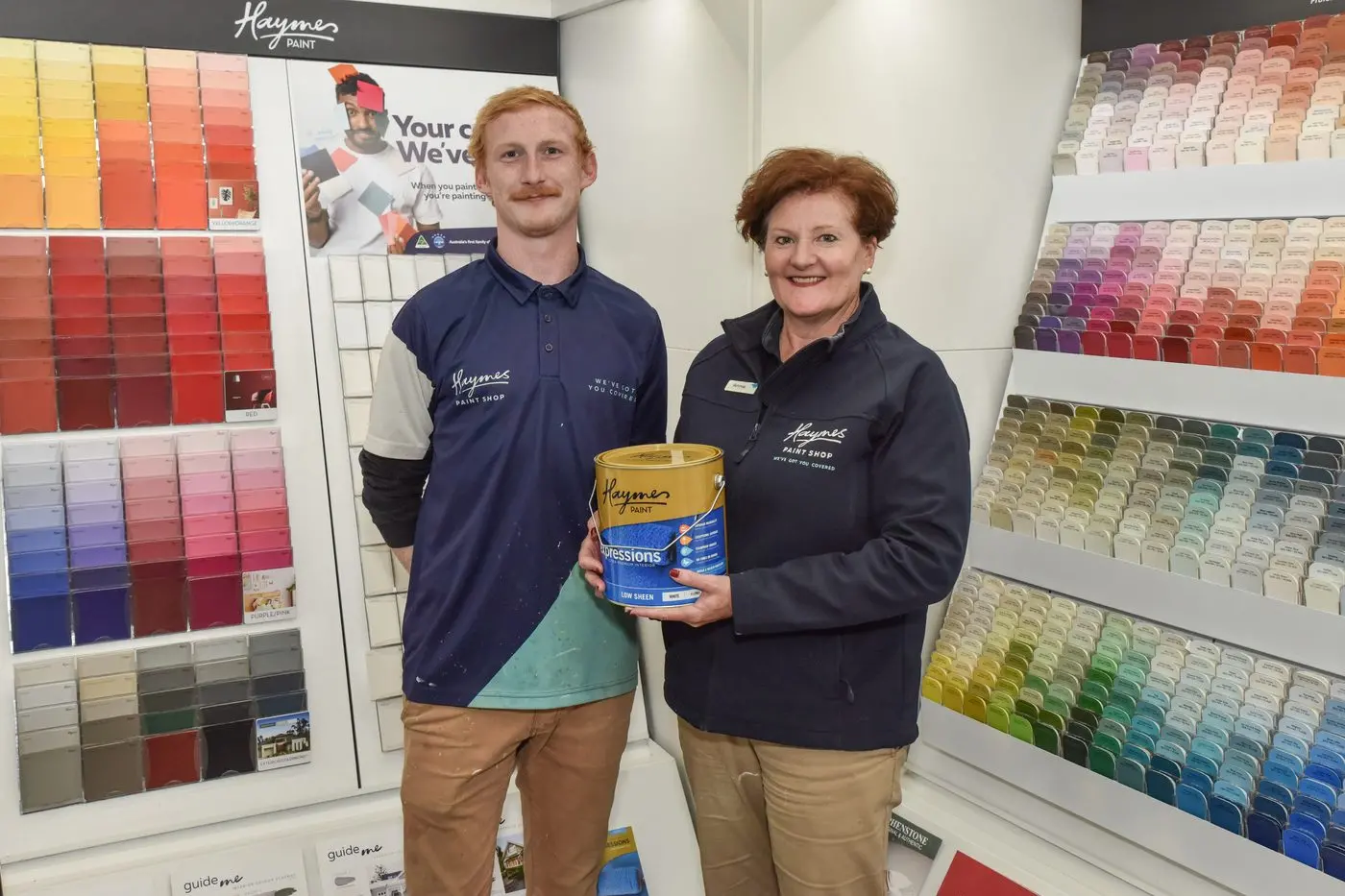 PRIZED PAINT PURVEYORS: Jacob Donlon and Annie Heetel from Haymes Paint Shop Wangaratta with some of their award winning paint. PHOTO: Kurt Hickling Id:29075