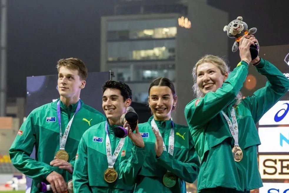 WORLD CHAMPS: Australia\\'s 4x400m mixed relay team  Jordan Gilbert, Jack Deguara, Bella Pasquali and Sophia Gregorevic on the podium after winning gold Wednesday morning. PHOTOS: Athletics Australia