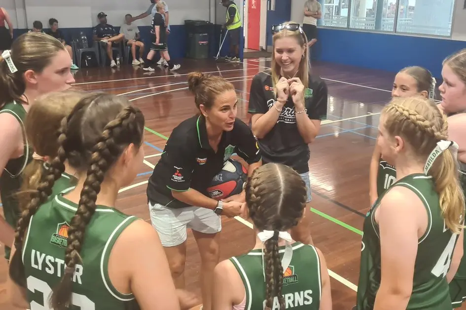 PSYCH UP: U14 div two coach Deb Emer and assistant Lily Cairns share the game plan with the side at the WBI tournament on the weekend.