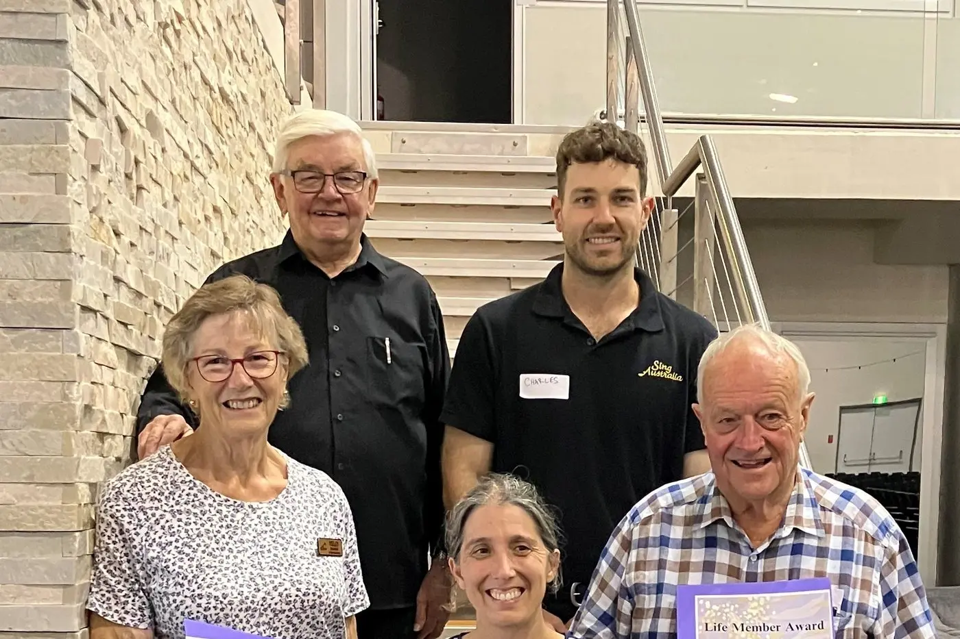 RECOGNITION: Outgoing Sing Australia director Colin Slater and new owner-director Charles Miller (back) with local life members (front), Albury\\'s Yelly Evehuis and Wangaratta\\'s Sarah Holmes-Brown and Keith Fleet.