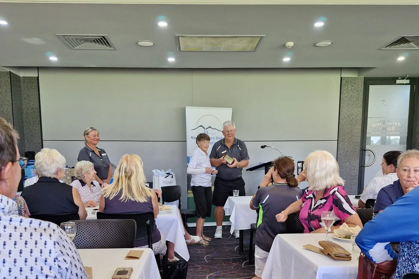WELL DESERVED: Marg Price was presented with her life membership by NEDGA president Phil Conway.