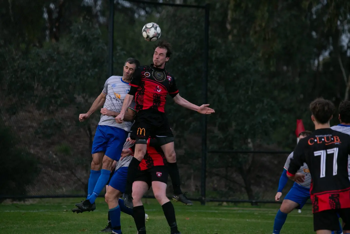 HEAD-TO-HEAD: Lorenzo Cecchini wins the header in the Devils 1-1 derby draw with Myrtleford. PHOTOS: Kat De Naps Photography