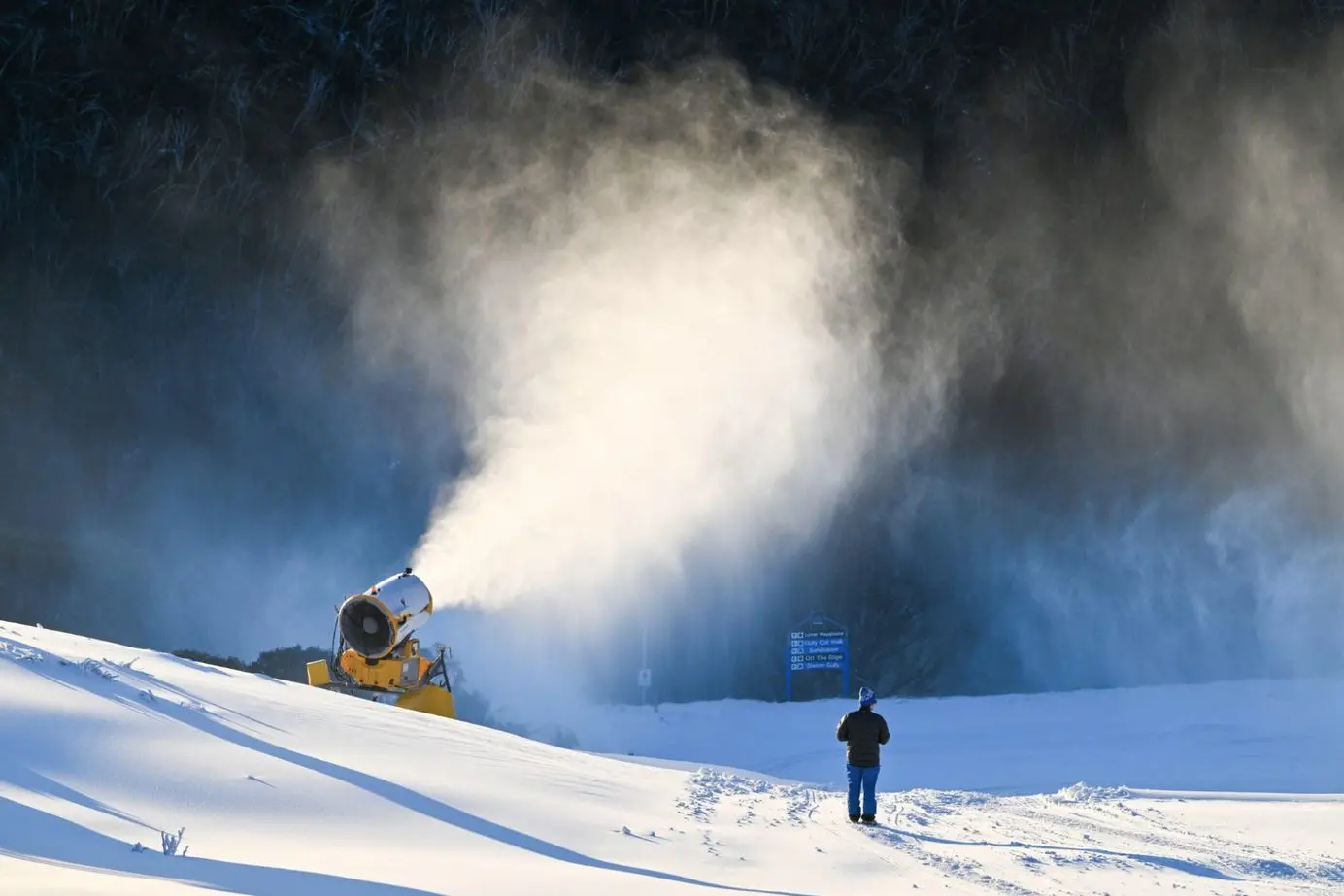 MAKING MORE SNOW: Natural and man-made snowfalls this week have both Mt Hotham and Falls Creek alpine resorts looking a treat for today and the weekend. Mt Hotham\\u2019s (pictured) mountain operations team have been busy making the most of back-to-back sub-zero temperatures, running on-going snowmaking across the mountain. They\\u2019ve been making so much snow, in fact, that Hothamhs been able to unlock even more ski and snowboard terrain for school holiday visitors, with the Heavenly Valley chairlift running for the first time from Friday morning. \\u201CHeavenly joins the Village Chair, Road Runner, Summit, Summit Trainer, Big D, Bunderool Carpet and Cobungra Platter in Dinner Plain,\\u201D said Luke Rickards, senior mountain operations manager. \\u201CWith these lifts running, we\\u2019ve got terrain on offer for all abilities, from first timers looking for their first snow experience, through to advanced skiers keen to make some turns on Imagine.\\u201D PHOTO: Mt Hotham Ski Lifts