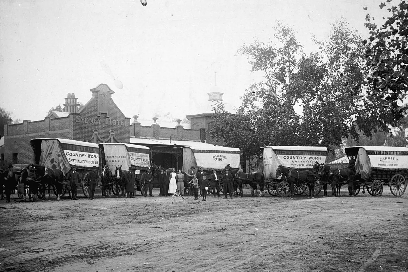 TREASURE TROVE: A line of carriers in front of the Sydney Hotel (Circa 1915), one of the Wangaratta images available on Trove. PHOTO: Courtney\\'s Thelma Studio, Museums Victoria, https://collections.museumsvictoria.com.au/items/769900 Id:26705