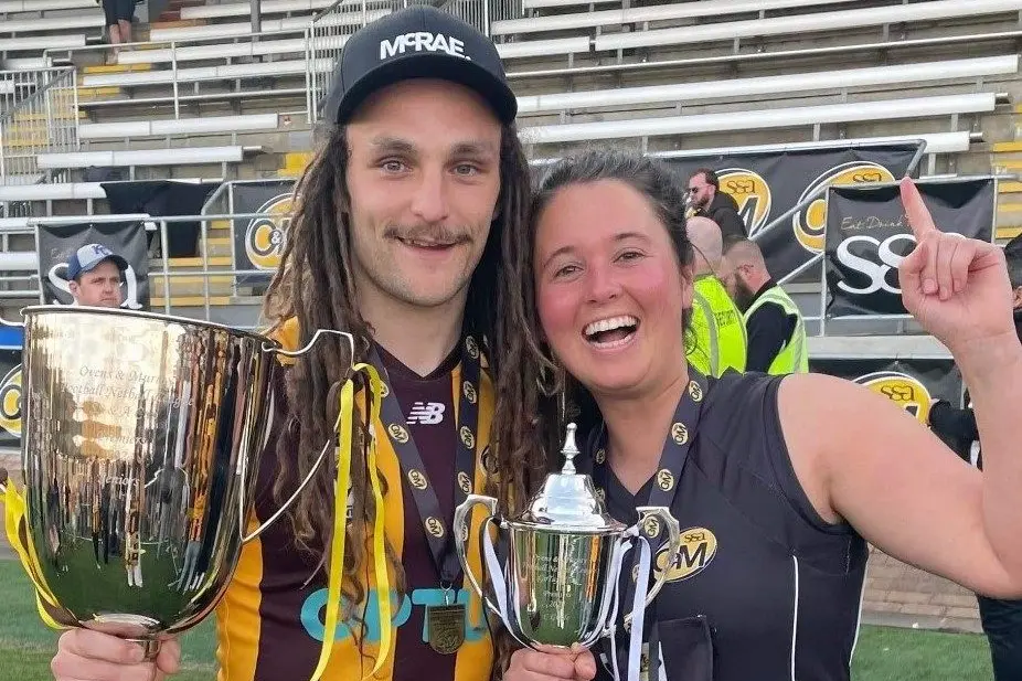 COLLECTING THE SILVERWARE: Will Nolan and Brooke Henwood celebrate their respective premierships on Sunday afternoon.