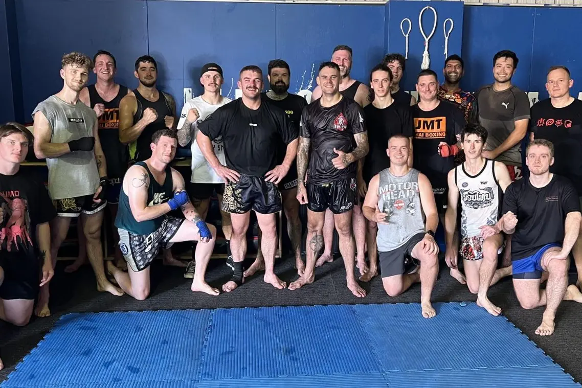 A HUGE HONOUR: Four-time Muay Thai world champion Toby Smith (centre) hosted a special two hour seminar at local Jenko\\'s Muay Thai gym on Saturday afternoon which thrilled the enthusiastic class of 16.