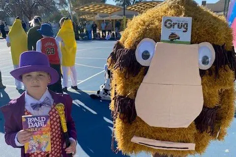 ALL DRESSED UP: Appin Park year one student William Triffitt and year five student Callum Bassett embraced this year\\u2019s book parade, dressing as characters Willie Wonka and Grug, respectively.