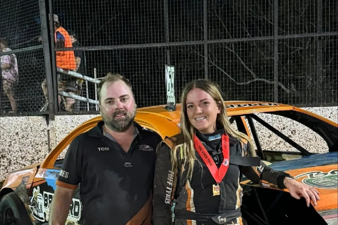 THE ORANGE RACER: Tay Barnard with husband Tom.