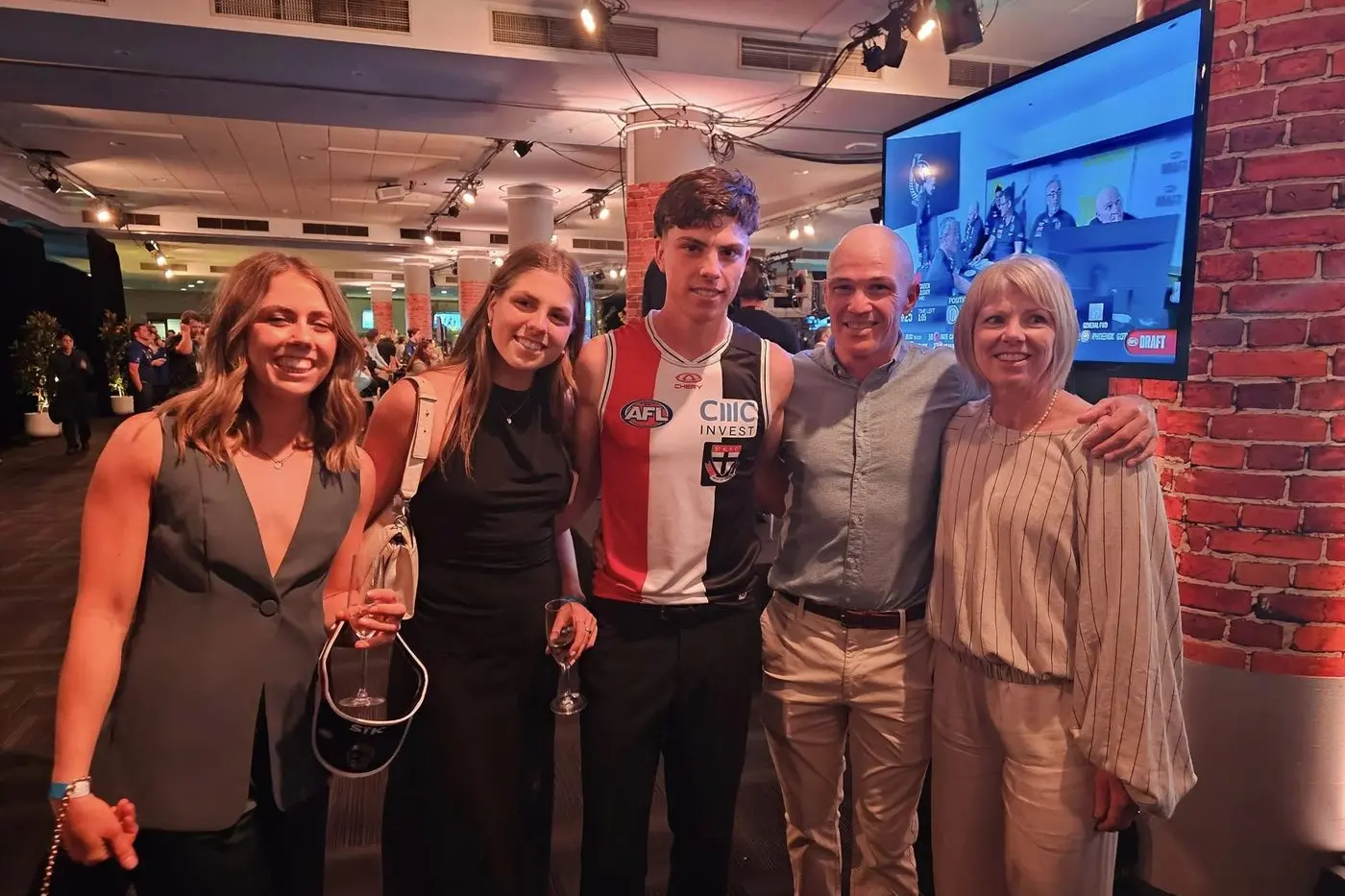 PROUD AS PUNCH: Darcy Wilson with sisters (from left) Brylee and Kelsie, dad Mick and mum Michelle after being drafted to St Kilda on Monday night.