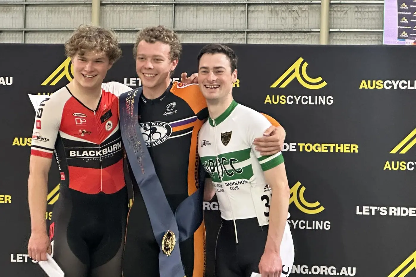 TOP STEP: Reuben Smith (centre) on the top step of the podium with second placed Hamish Clarkson and third placed Callum Porritt after claiming the men\\'s Melbourne Cup on Wheels.