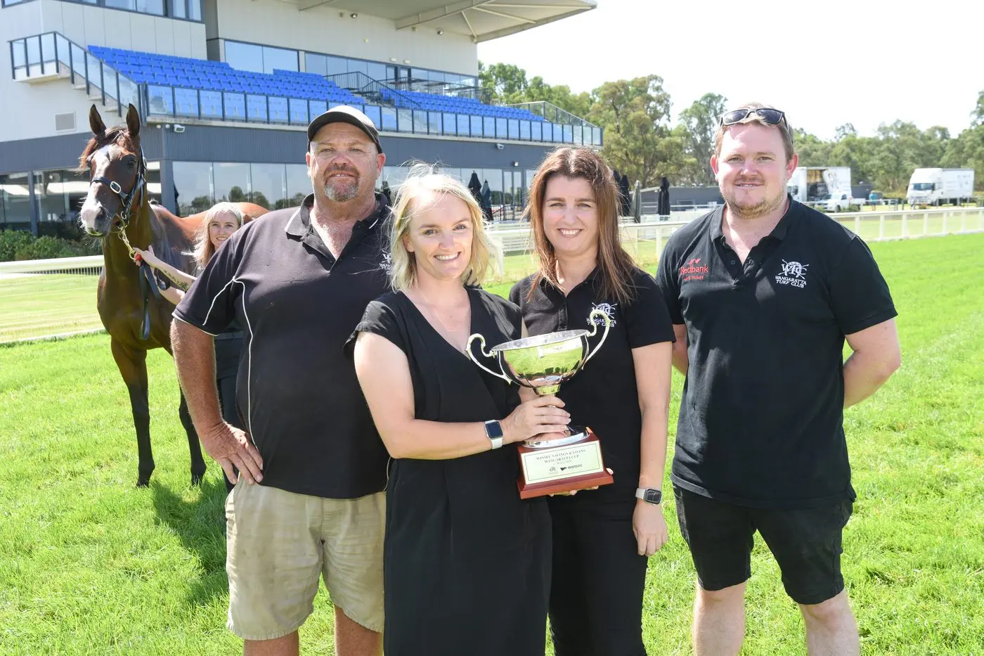 BRING ON THE CUP: Wangaratta Turf Club CEO Emma Merlo (centre), strappers (front, from left) Greg Brown, Courtney Purcell and Lachlan Hart, (back) \\'Fox Appeal\\' and strapper Dannii French are excited about bringing the Winsec Savings and Loans Wangaratta Cup races to the community this Saturday. PHOTO: Kurt Hickling