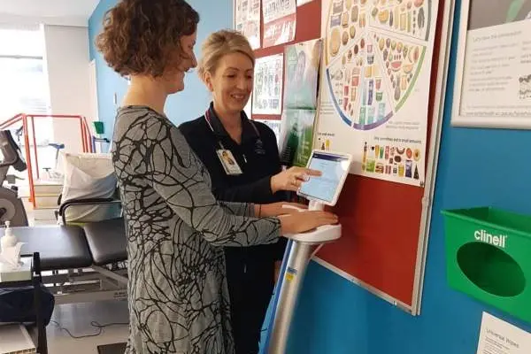 TEST RUN: Allied health assistant at NHW Jayne Bell assisting Alison Gargan (manager physiotherapy at NHW) test the new SOZO.