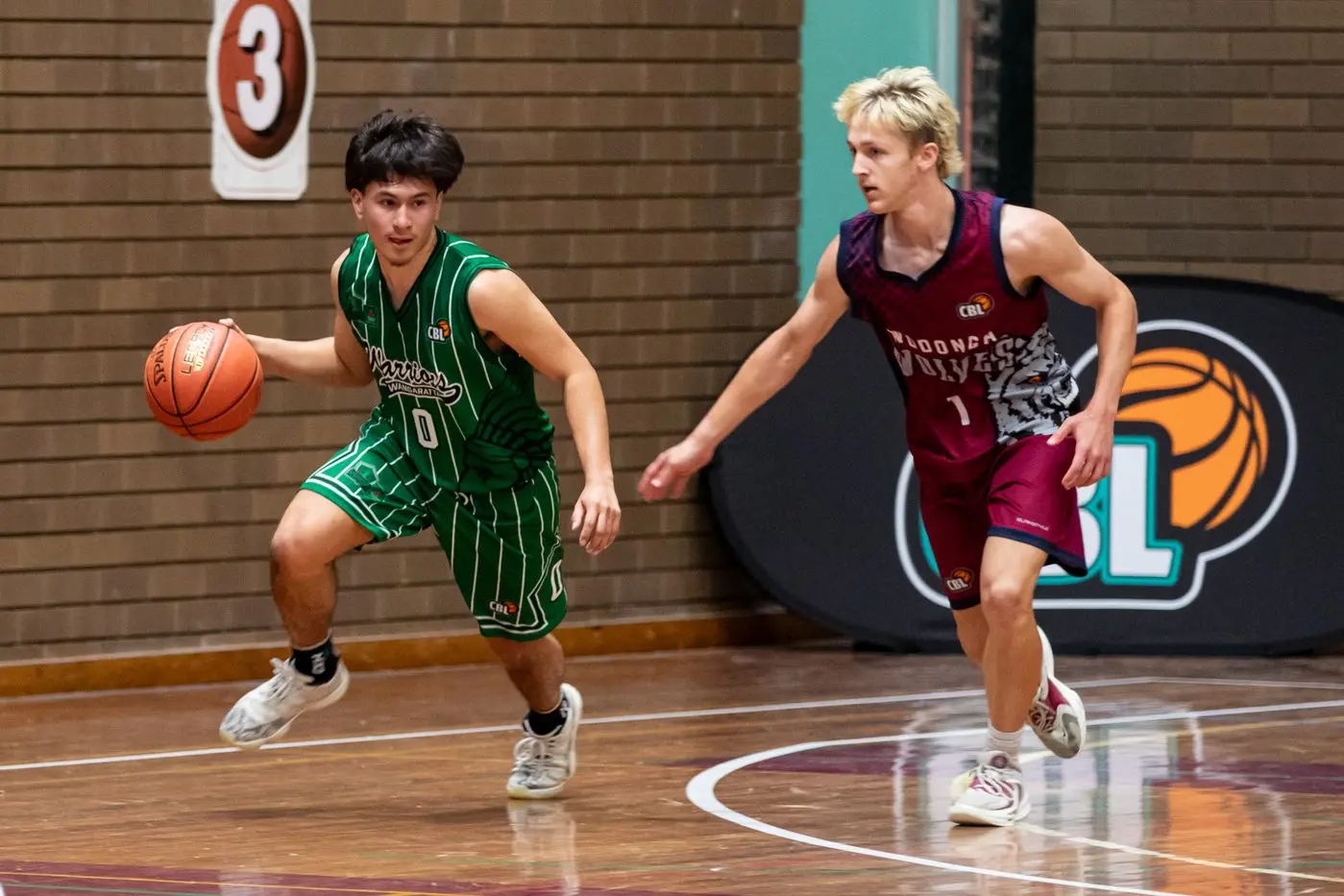 RAPID MOVEMENT: Anthony Mora works his way around Wodonga\\'s Coen Ainsworth. PHOTOS: Marc Bongers