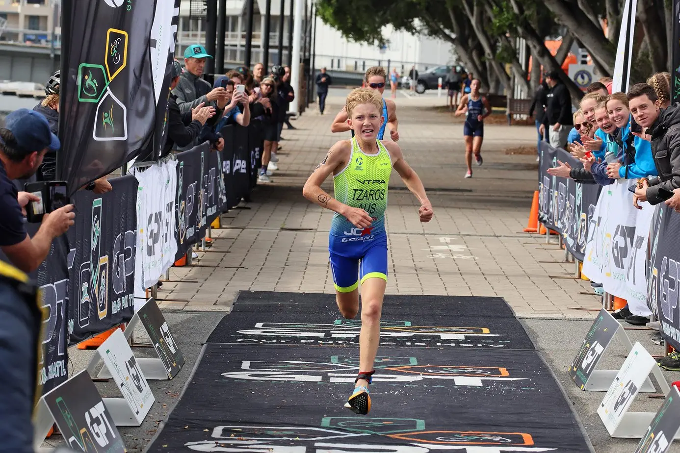 SPRINT TO THE END: Merlin Tzaros brokethrough for his first nationals triathlon event victory in Port Adelaide a fortnight ago, beating out fellow Victorian Bentley Crisp in a sprint finish in the youth 13\\u201315 male category. Id:40497