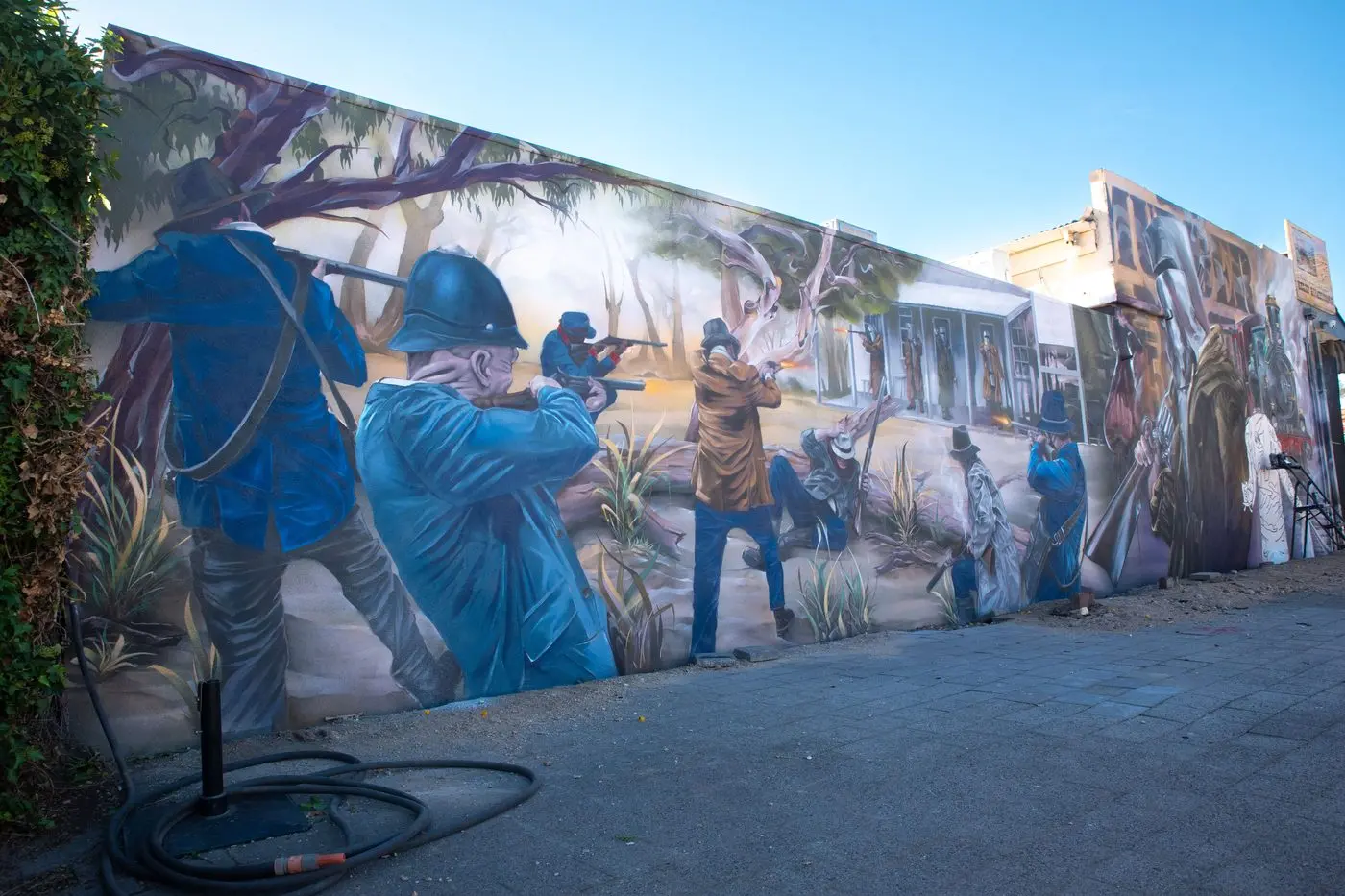 LAST STAND: It\\u2018s taken a month, but Melbourne street artist Andrew J Bourke\\u2018s masterpiece of Ned Kelly and the Kelly gang\\u2018s last stand has been completed at Glenrowan. PHOTOS: Kurt Hickling