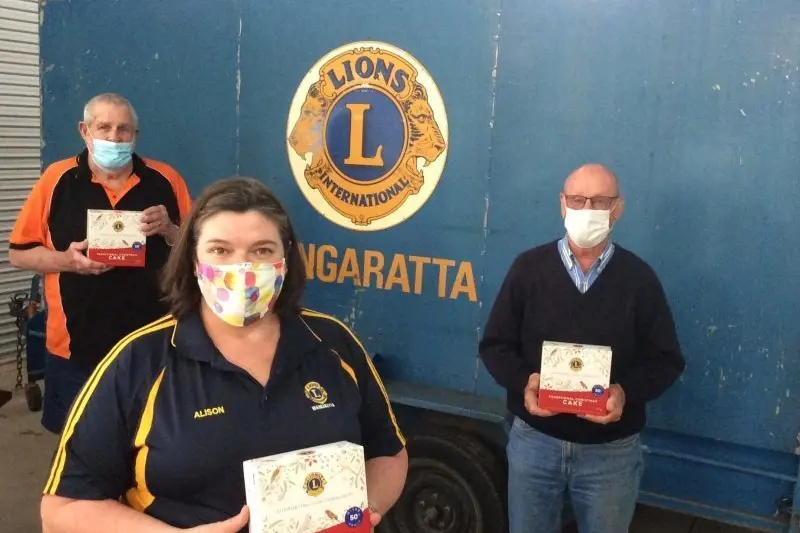BUY A CAKE: Wangaratta Lions Club members Bill Ahearn, Alison Kazenwadel and Clive Pullen hope locals will support the club\\u2019s annual Christmas cake sales, following the cancellation of the Swap Meet and Collectables Market and Carols By Candlelight events. 