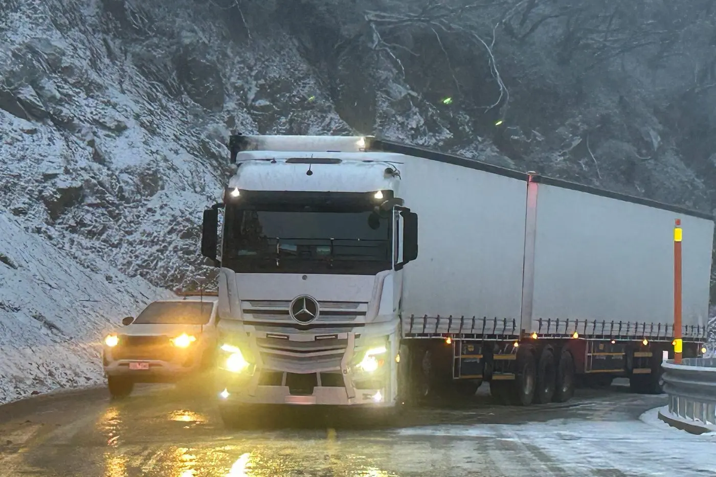 IN TROUBLE: A B-double truck was stuck at Mount Hotham for several hours on Sunday night due to slipping on icy conditions at Diamantina Corner. PHOTO: Supplied\\n