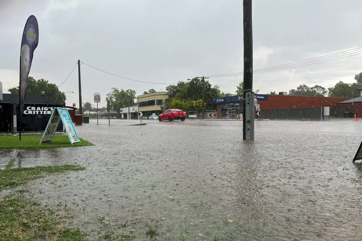 FLASH FLOODING: The thunderstorms and torrential downpour which hit Wangaratta last Tuesday afternoon caused flash flooding in Rowan Street. PHOTO: Jeff Zeuschner