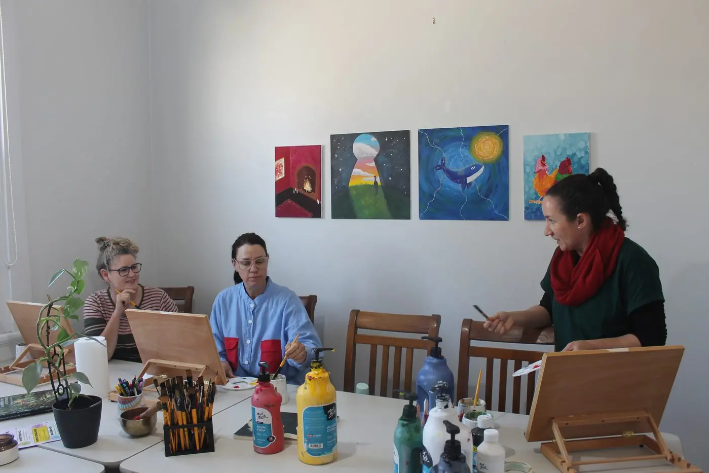 GUIDED WORK: Art teacher Isobelle Cremin guides an afternoon group class through perspective painting. PHOTO: Grace Fredsberg
