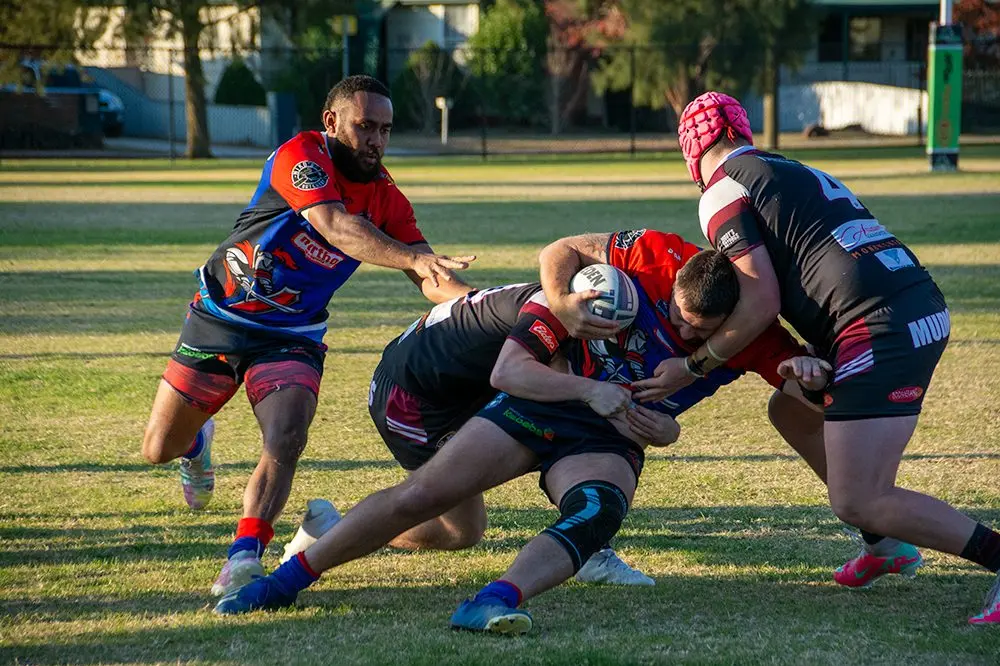 HITTING THE WALL: Mitieli Parauni (right) lends a hand as Knights captain Scott Miller(left) is being tackled.