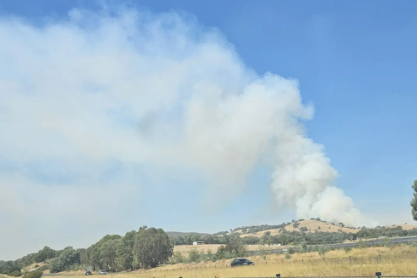 FIRE STILL BURNING: Local firefighters and emergency service personnel have been working diligently to contain a 25 hectare grass and scrub fire on Glenrowan-Moyhu Road since Monday afternoon. The Glenrowan, Laceby and Greta West communities have been urged to continue to monitor conditions as firefighters looked to build a containment line and conduct back-burning in the difficult to reach bushland. PHOTO: Amanda Chrystal