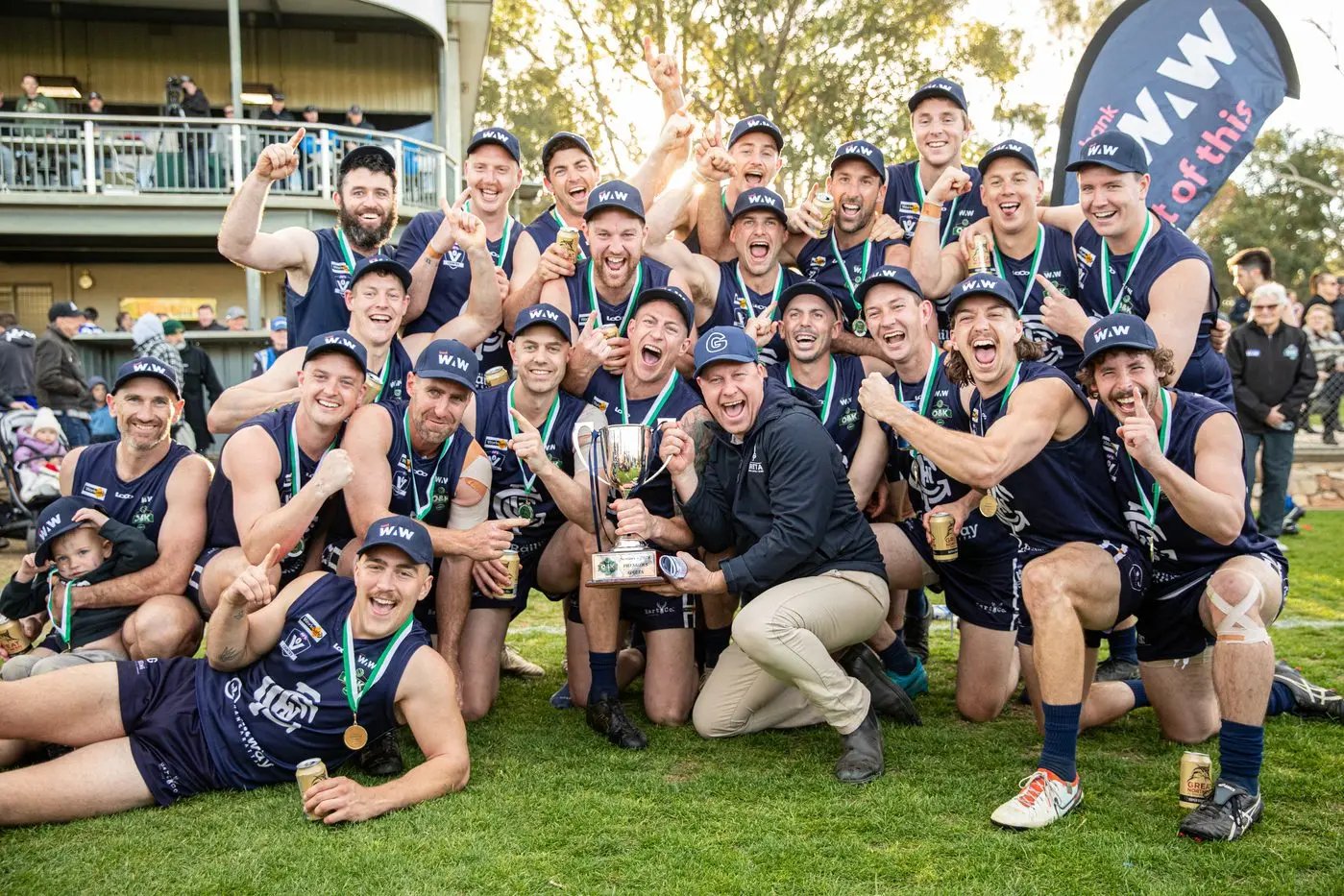 HUNGRY FOR MORE: Chris Dube (centre) celebrates Greta\\'s 2024 premiership as he re-commits as coach for the next two seasons, saying his side will look even stronger next year. PHOTO: Marc Bongers
