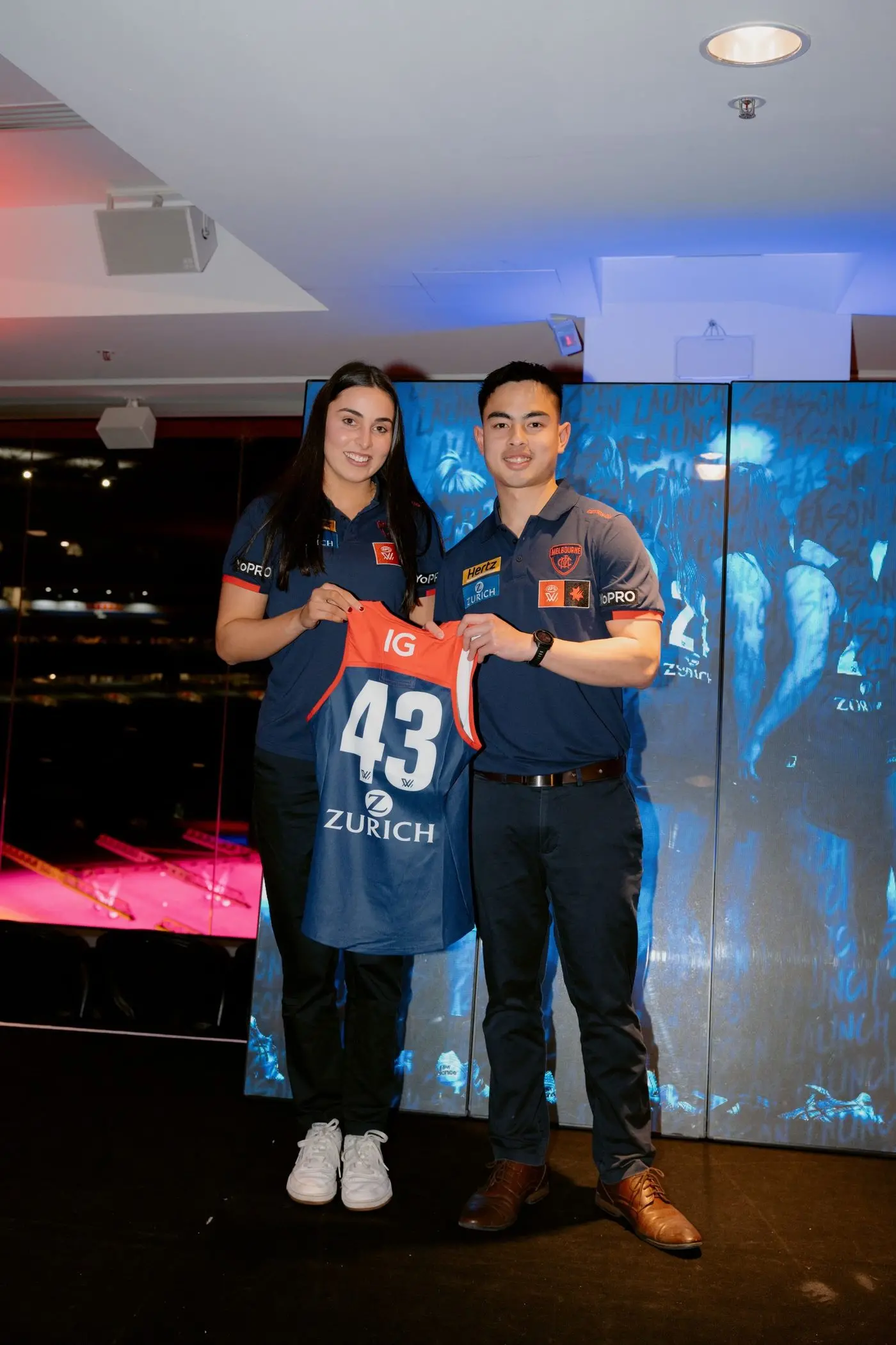 MAKING HER MARK: Jemma Rigoni presented with the number 43 jumper by Melbourne AFLW midfield coach Vincent Chungue.